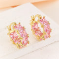 Geometric U-shaped gold electroplated earrings with round black zirconium stones