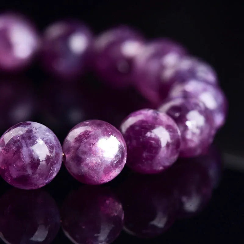 Geometric Korean-style polished crystal bracelet showing pink, pink purple, and purple colour options.