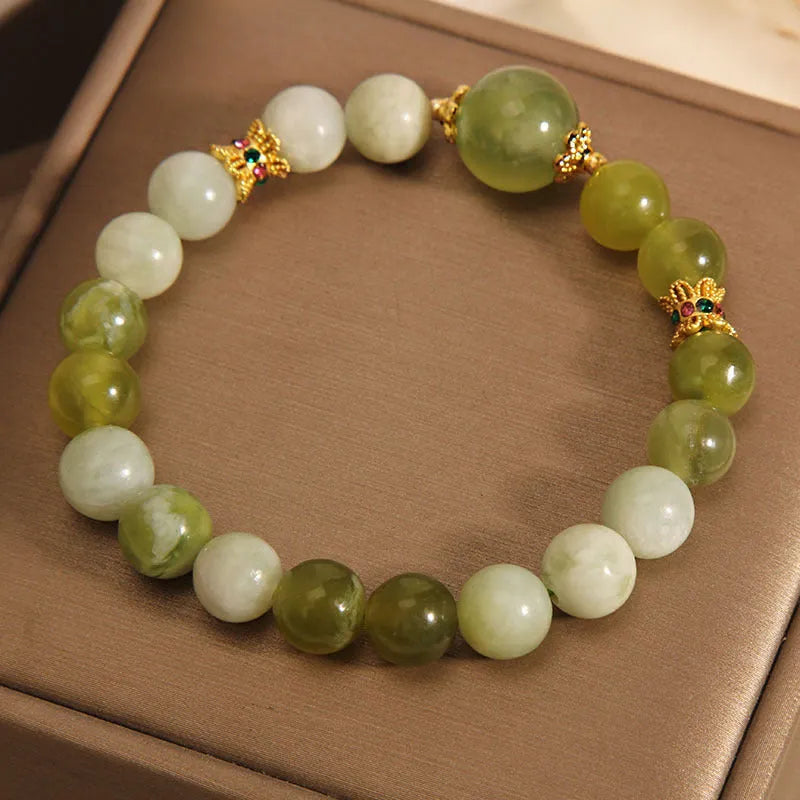 Original design women's bracelet with a green Xiuyan jade stone centrepiece.