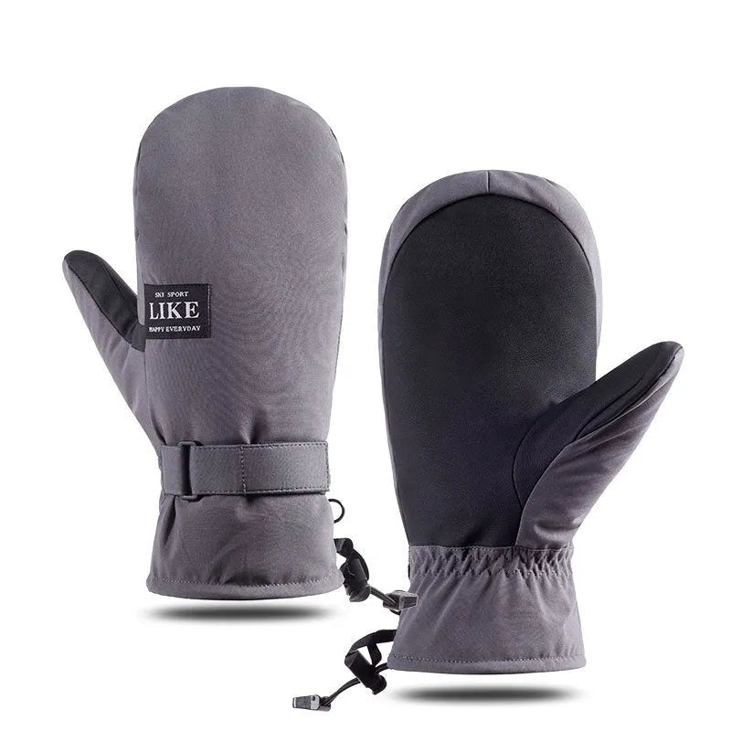 A pair of thick black winter cycling mittens with touch screen fingertips on a bicycle handlebar.
