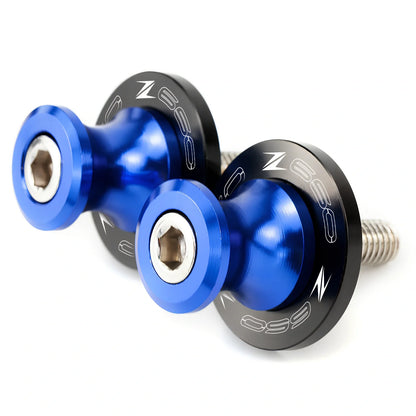 Pair of 8mm CNC aluminium swingarm spools sliders in titanium for Kawasaki Z650 Z900, with Delrin contact and stainless bolts