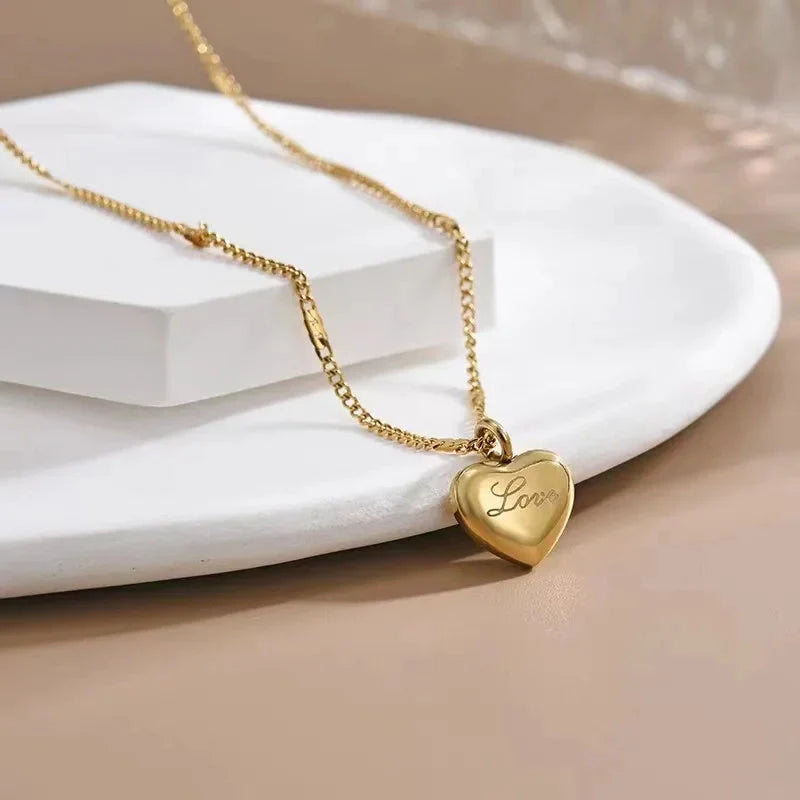 Vintage gold-toned love heart pendant necklace on a sectional chain