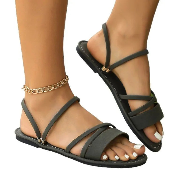 Women's flip-toe buckle sandals with cross straps in black, brown, or green colours