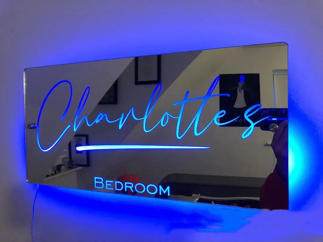Personalised acrylic name mirror light with LED glow on wall in picture colour