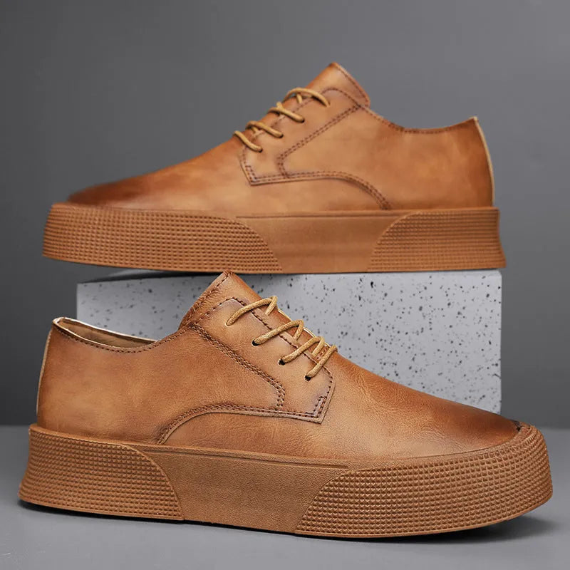 Men's lace-up platform board shoes in solid brown with round toe and low-top silhouette on a neutral background