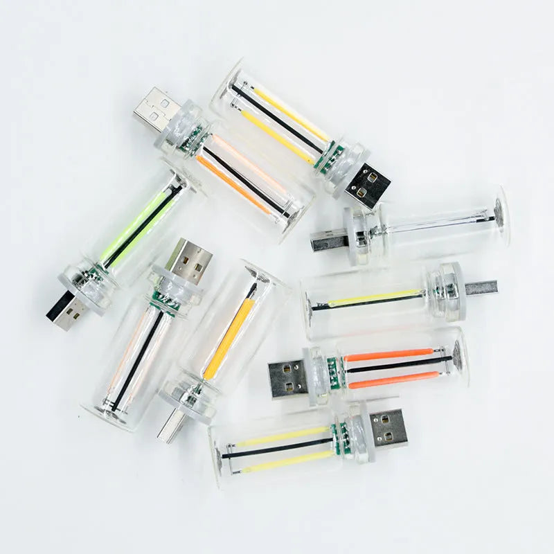 RX9001 transparent glass USB touch night lamp showing compact size and modern design.