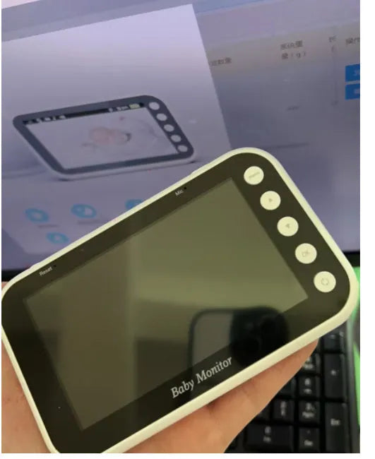 43 inch baby monitor with 4.3 inch LCD screen showing a baby in a cot