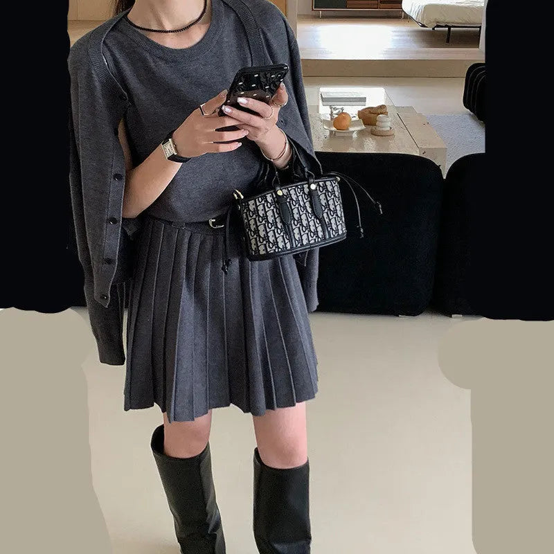 Women's grey art retro knitted vest skirt and long-sleeved cardigan two-piece set with belt.