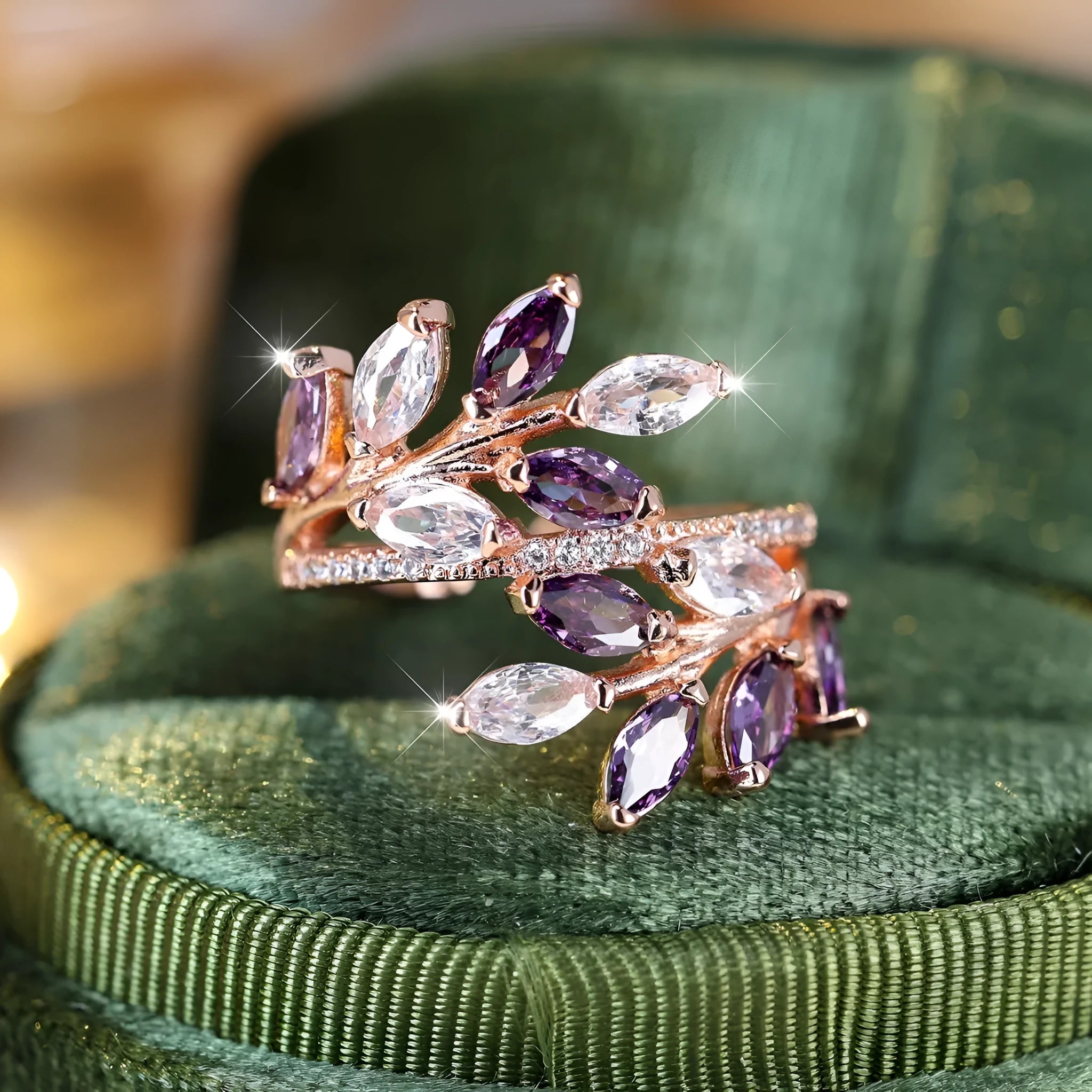 Adjustable copper leaf ring with a zircon stone in a choice of rose gold or platinum finishes.