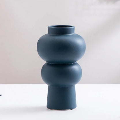 Nordic minimalist ceramic vase in blue, yellow, and orange with glazed finish