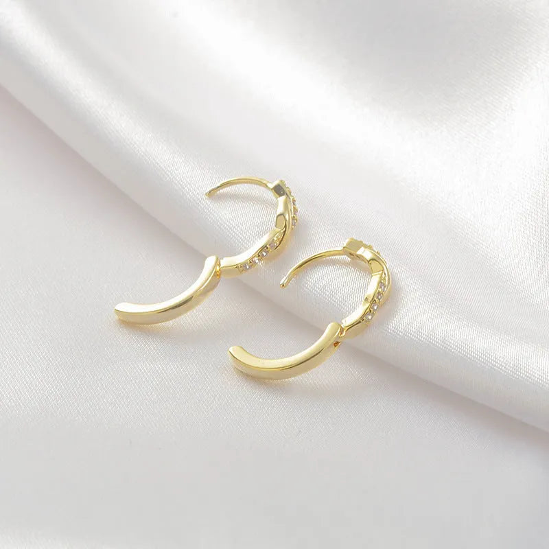 Gold and silver geometry-shaped interwoven hemp rope earclip earrings for women.