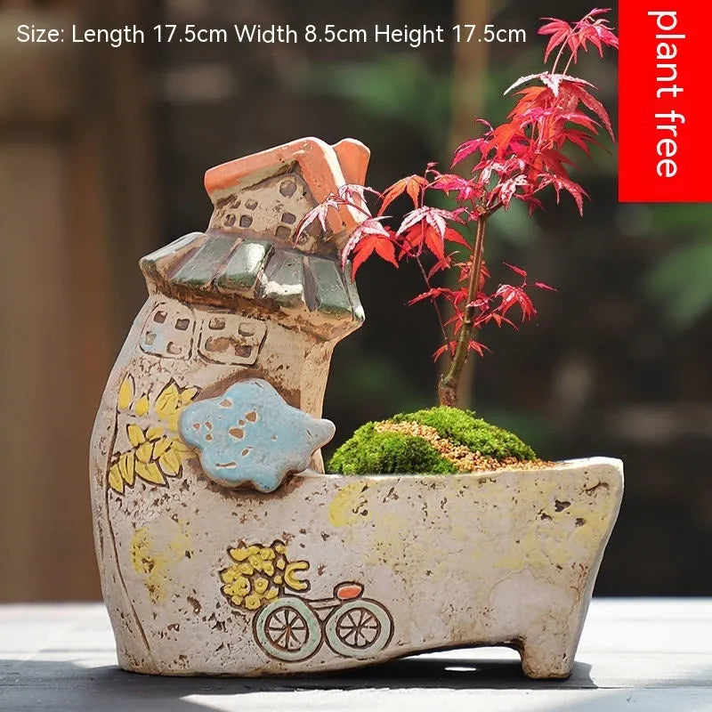 Hand-painted ceramic flower pot with pastoral design and large planting area