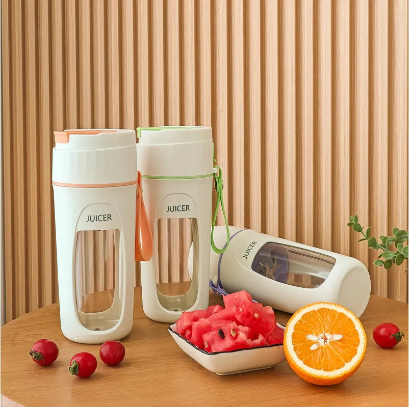 Fresh Orange portable USB blender with borosilicate glass cup on a table