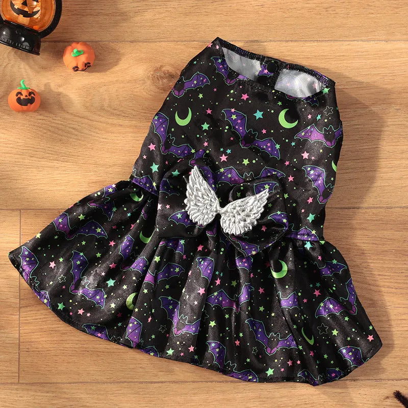Orange Halloween dog costume with angel wings and a halo, featuring a bright pumpkin print design.