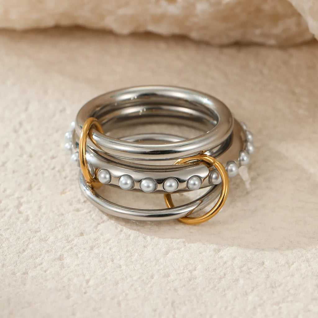Stacked colour matching stainless steel rings with 18K gold plating in free size format
