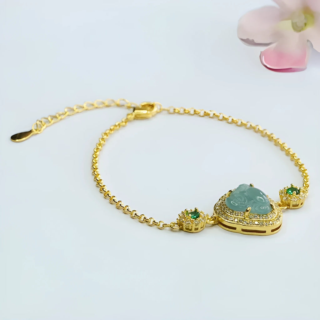 Blue water jade bracelet with oval 10x13mm bead showing inlaid Maitreya Buddha carving