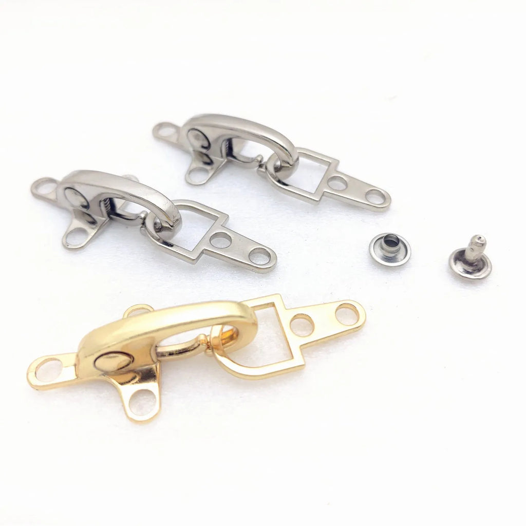 Zinc alloy aircraft-shaped hanging buckle in metallic finish, shown next to a ruler indicating 5.85cm size.