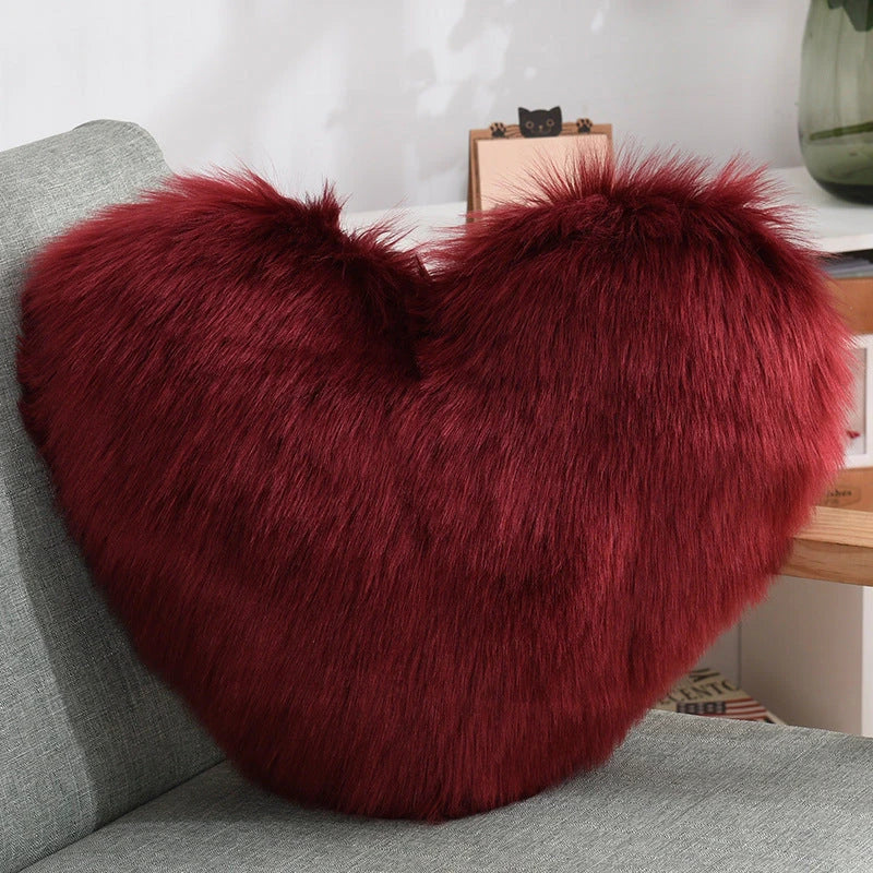 Plush heart-shaped throw pillows in various colors and styles for cozy sofa decor