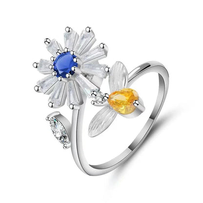 Adjustable rotating spinner ring with elegant flower and bee design in various color options