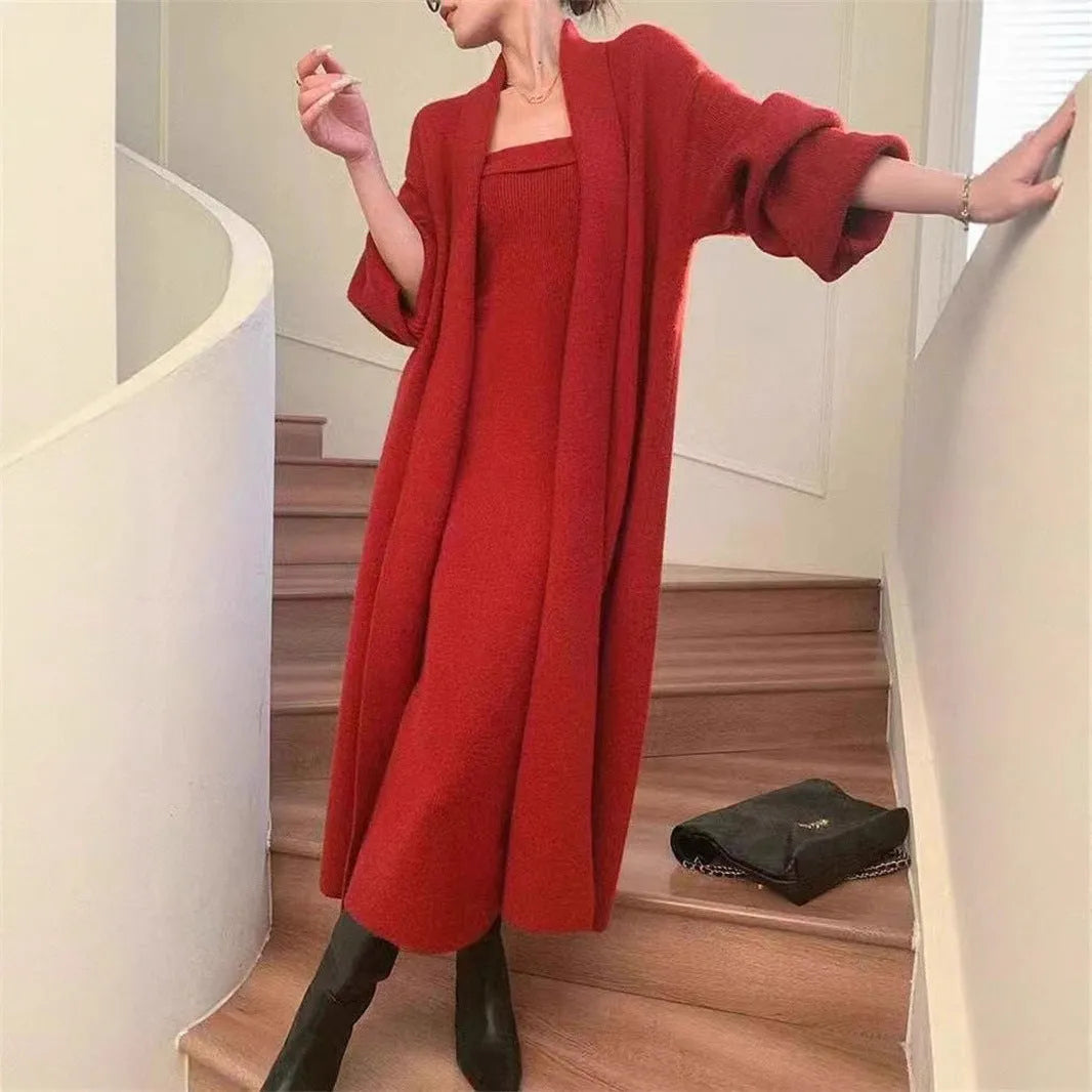 Women's grey knitted cardigan dress suit set with long skirt and flocking detail.