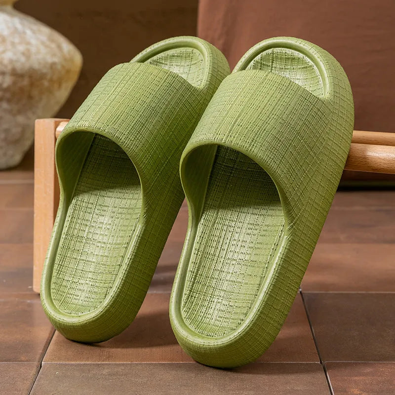 A pair of soft-bottom EVA bath slippers with a toe ring and non-slip sole, shown in one of five available colours.