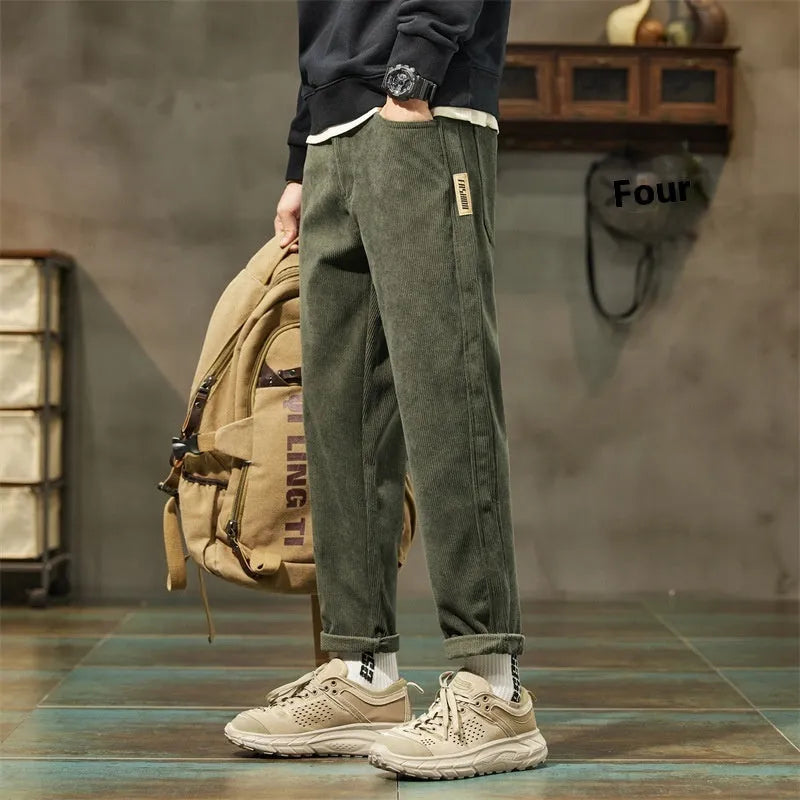Men's corduroy casual trousers in tapered straight-leg style with mid waist and zip fly