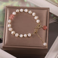 Women's irregular freshwater pearl adjustable bracelet on a plain background showing the alloy clasp and irregular pearl beads