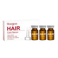 Three small 5ml vials of botanical hair root liquid for scalp treatment, containing ginger and rosemary oils.