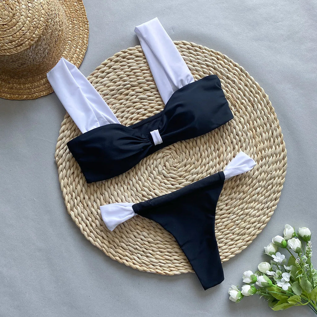 Black women's bikini with leopard print tube top and matching split T-back pant.
