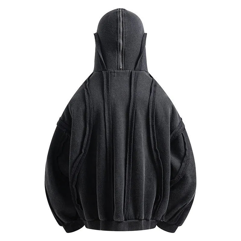 Black loose-fit padded cotton cardigan with a zip front and hood on a model.