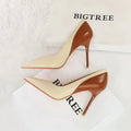 Women's black retro pumps with a pointed toe and high stiletto heel on a white background.