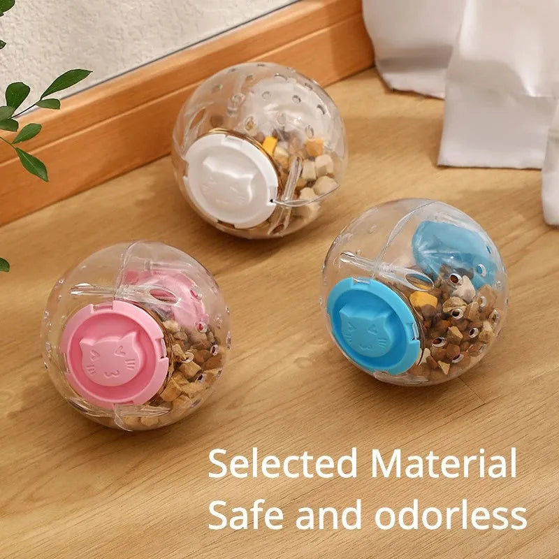 Blue slow feeding ball for cats with visible food compartment, 11.5cm diameter