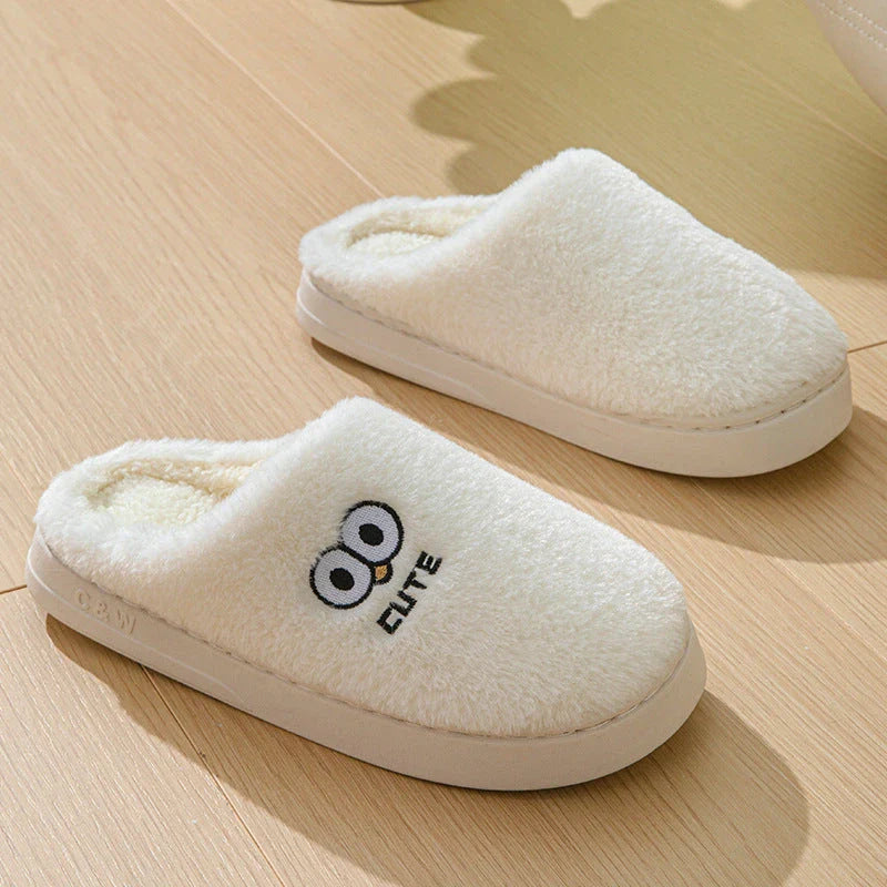 Cozy cartoon slippers with big eyes in various colors, featuring plush material and non-slip rubber soles for comfortable indoor wear