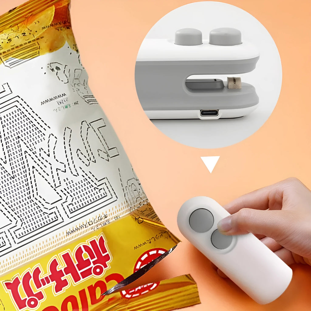 White handheld vacuum sealing machine with magnetic back and cutter blade for chip bags