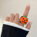 Halloween knuckle ring with epoxy finish and cartoon pumpkin bat ghost motifs in multiple colours