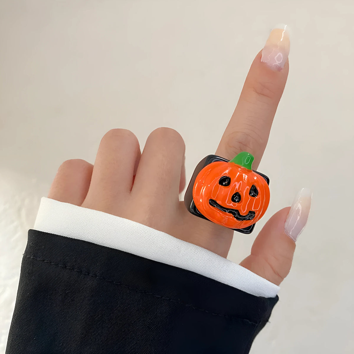 Halloween knuckle ring with epoxy finish and cartoon pumpkin bat ghost motifs in multiple colours