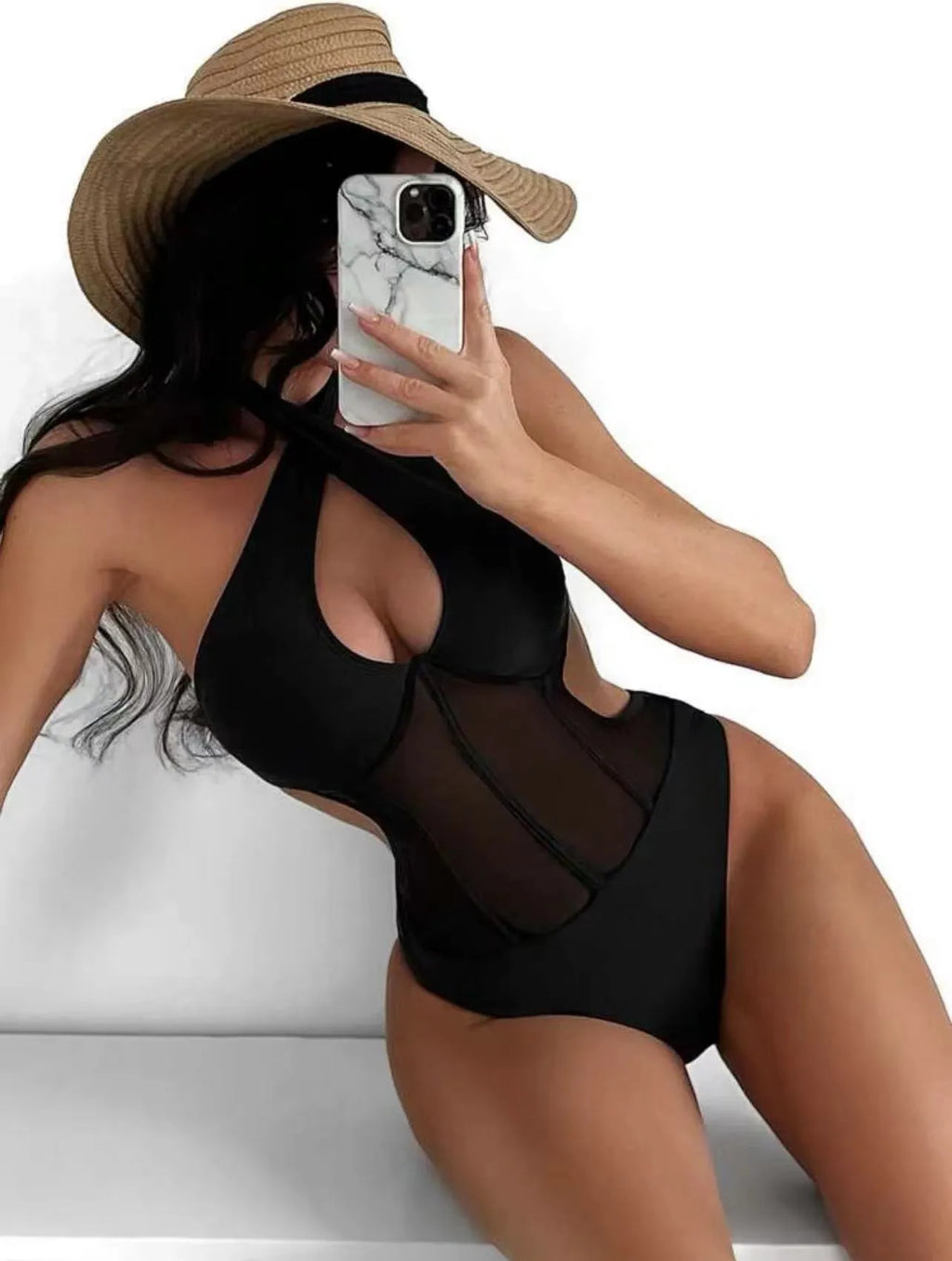 Women's black one-piece swimsuit bikini made from nylon and spandex fabric on mannequin