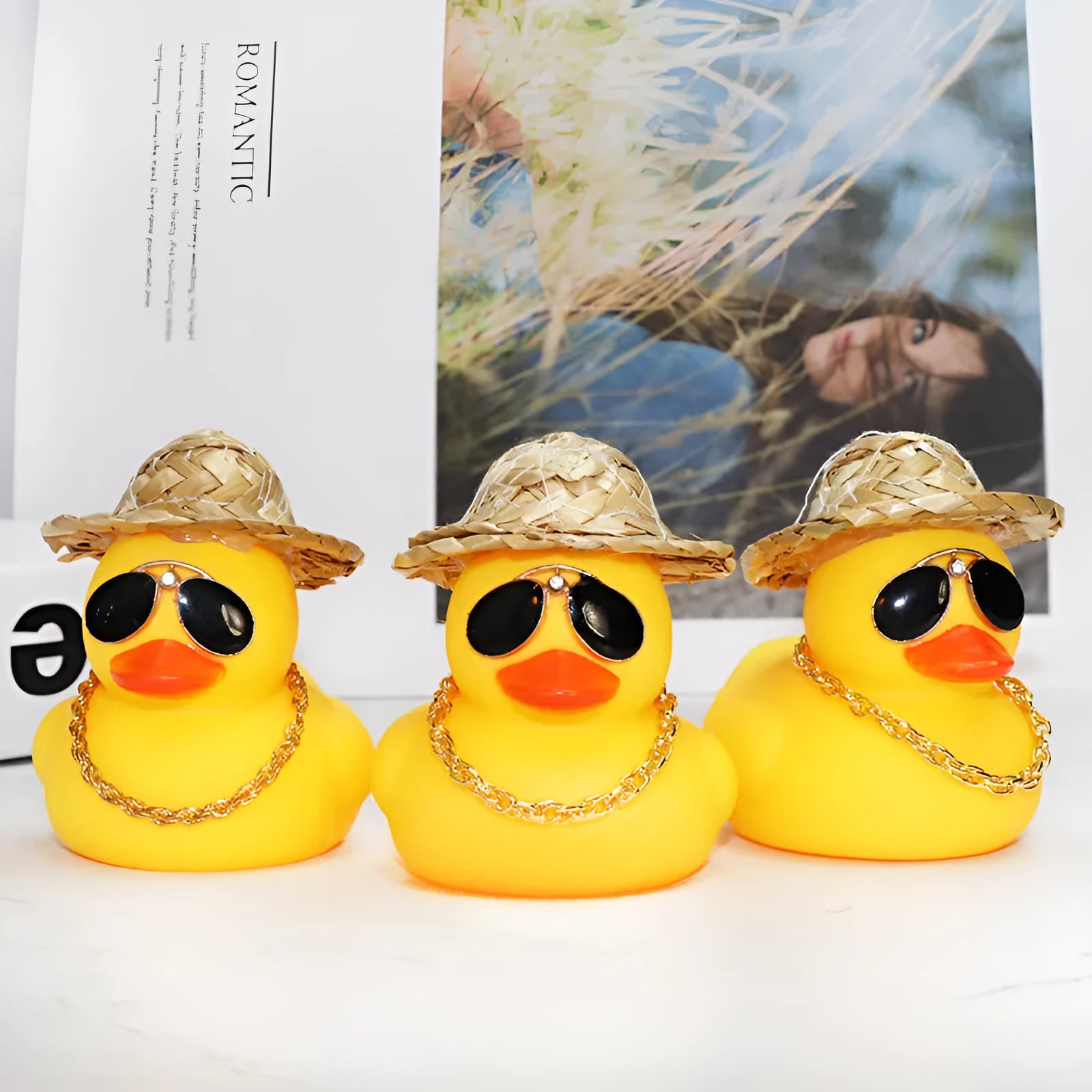 Yellow cartoon duck wearing a straw hat car decoration with adhesive glue and sunglasses accessory.
