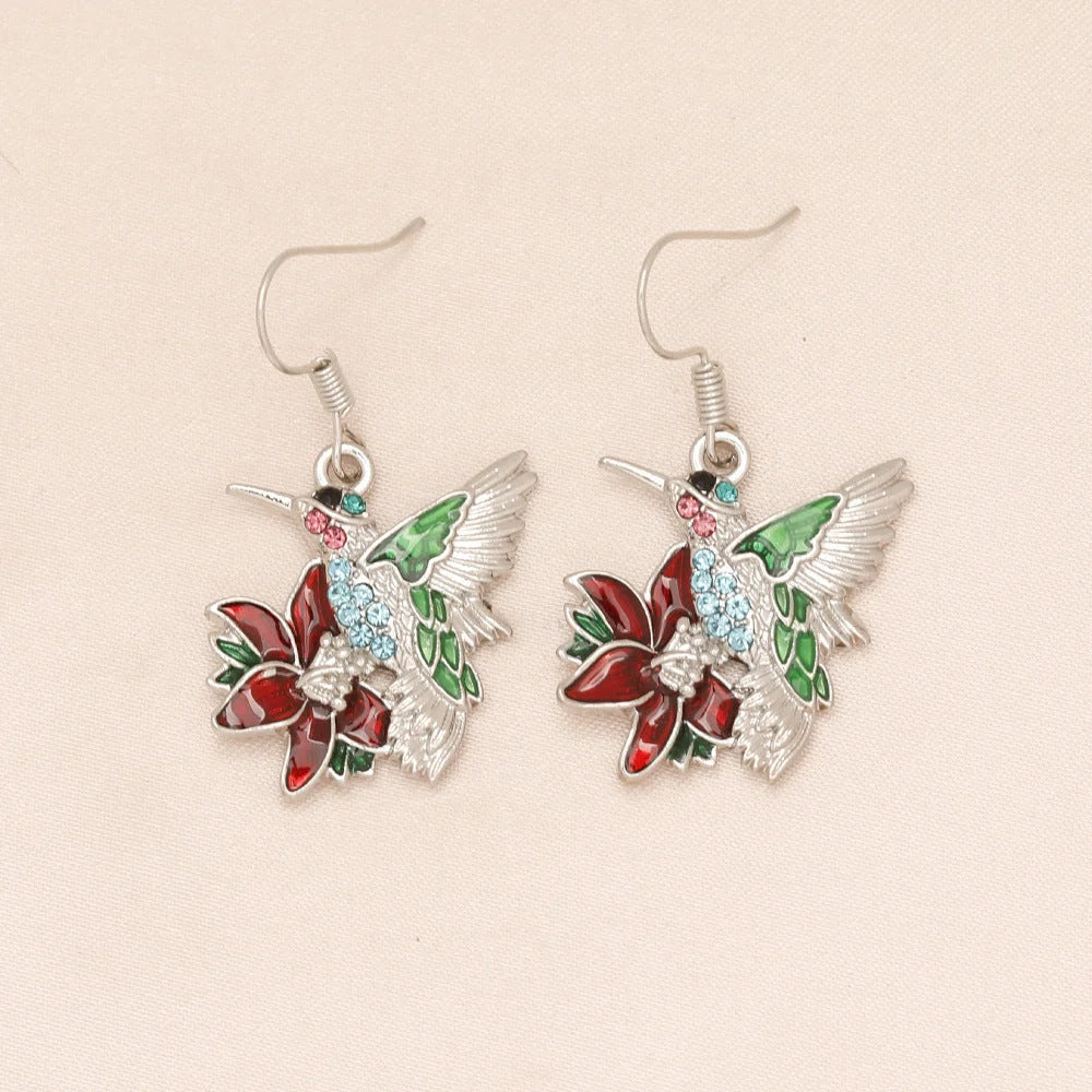 Hummingbird diamond pendant earrings with water droplet design in silver and green