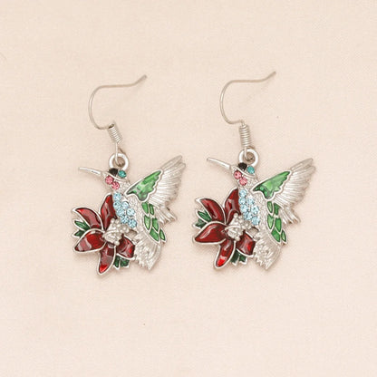 Hummingbird diamond pendant earrings with water droplet design in silver and green