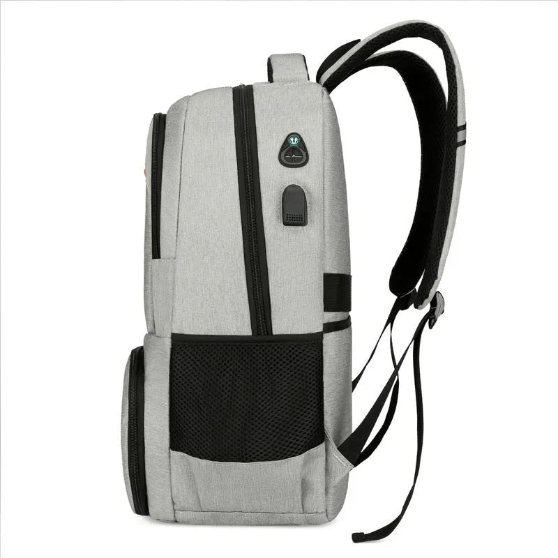 Light grey insulated Oxford cloth backpack with curved shoulder straps on a neutral background.