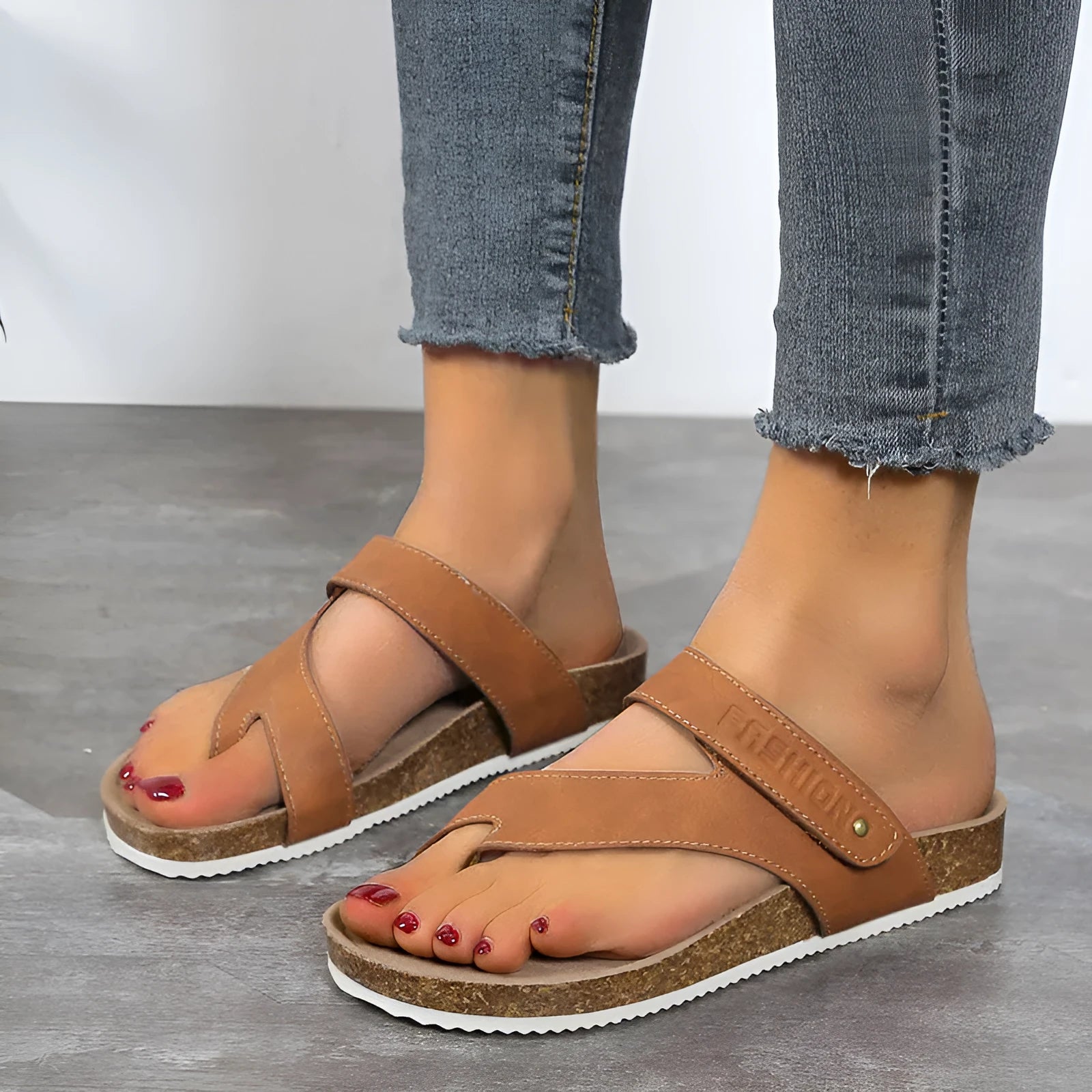 Flat toe ring flip-flops with thick foam sole in blue colour on a white background.