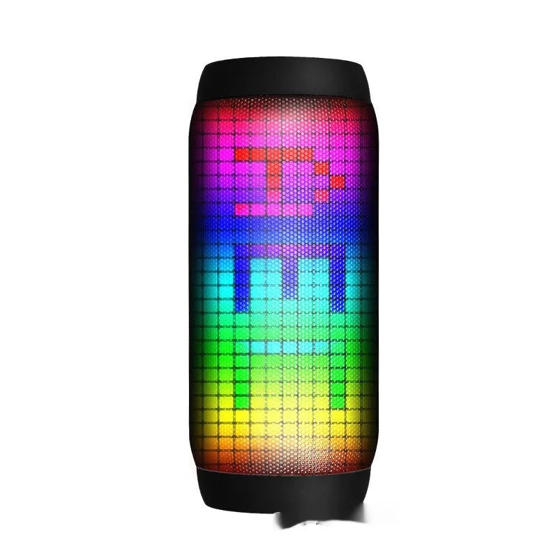 Black Bluetooth speaker with metal shell, colourful LED lights, and button controls on a desk
