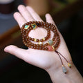 Brown jade Hetian jade three-ring bracelet with silver butterfly and gourd charms