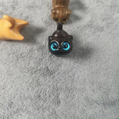 Handcrafted sandalwood kitten ornaments in various styles and colours