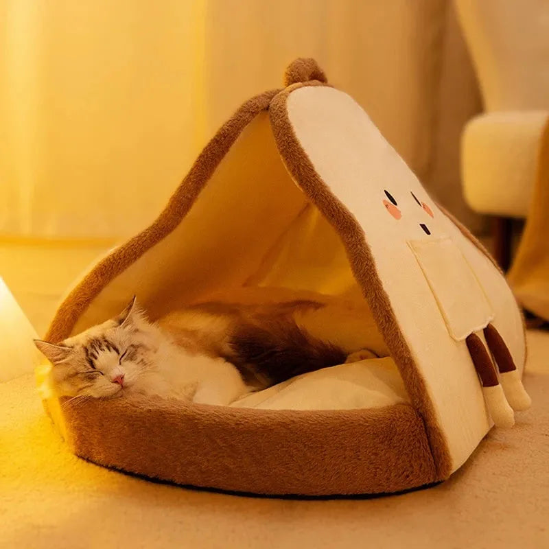 Green insulated cat tent pet bed with fleece blanket, shown in a home setting.