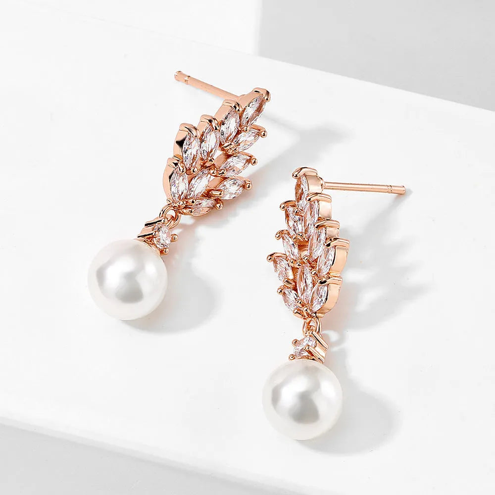 Geometric flower earrings with micro inlaid zircon stones and pearl elements in three plating colours