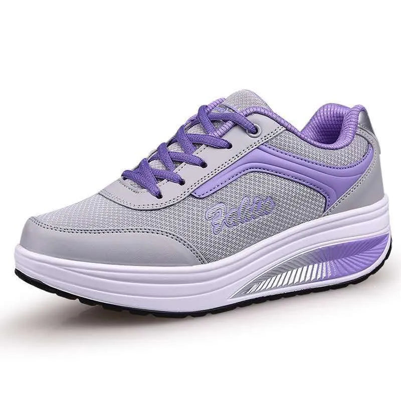 Women's single travel sports shoe in a choice of colours with a mid heel.