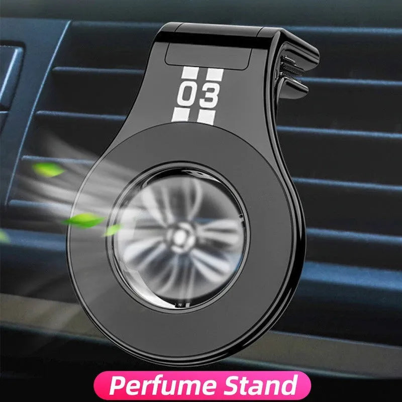 Magnetic car phone holder mounted on air vent with smartphone attached and fragrance slices