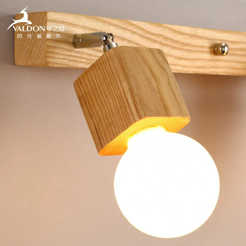 A narrow 24cm wide mirror-finish LED wall lamp with a single light head.